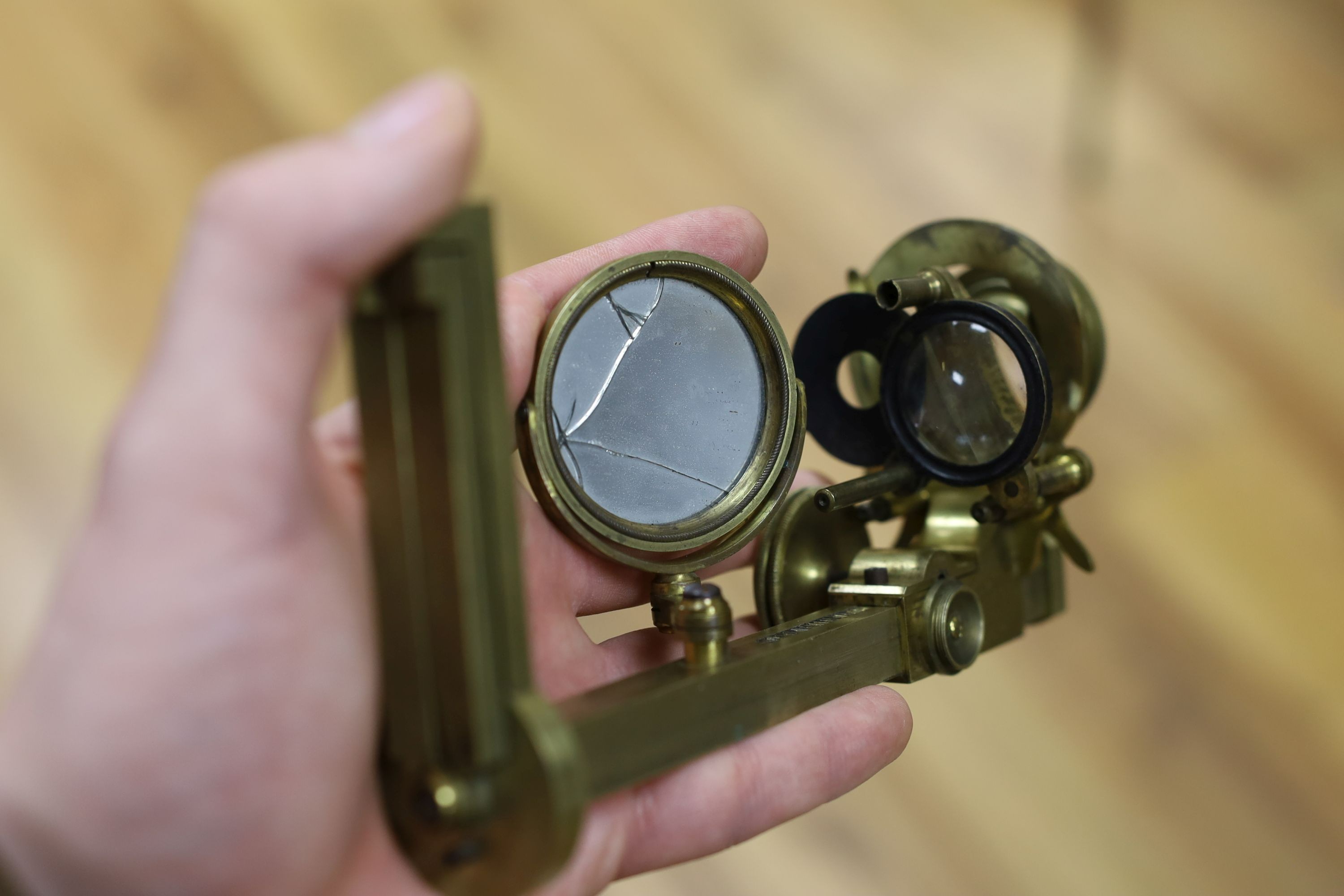 A mahogany cased microscope and a pair of Burdizzo tail dockers, 40cms long